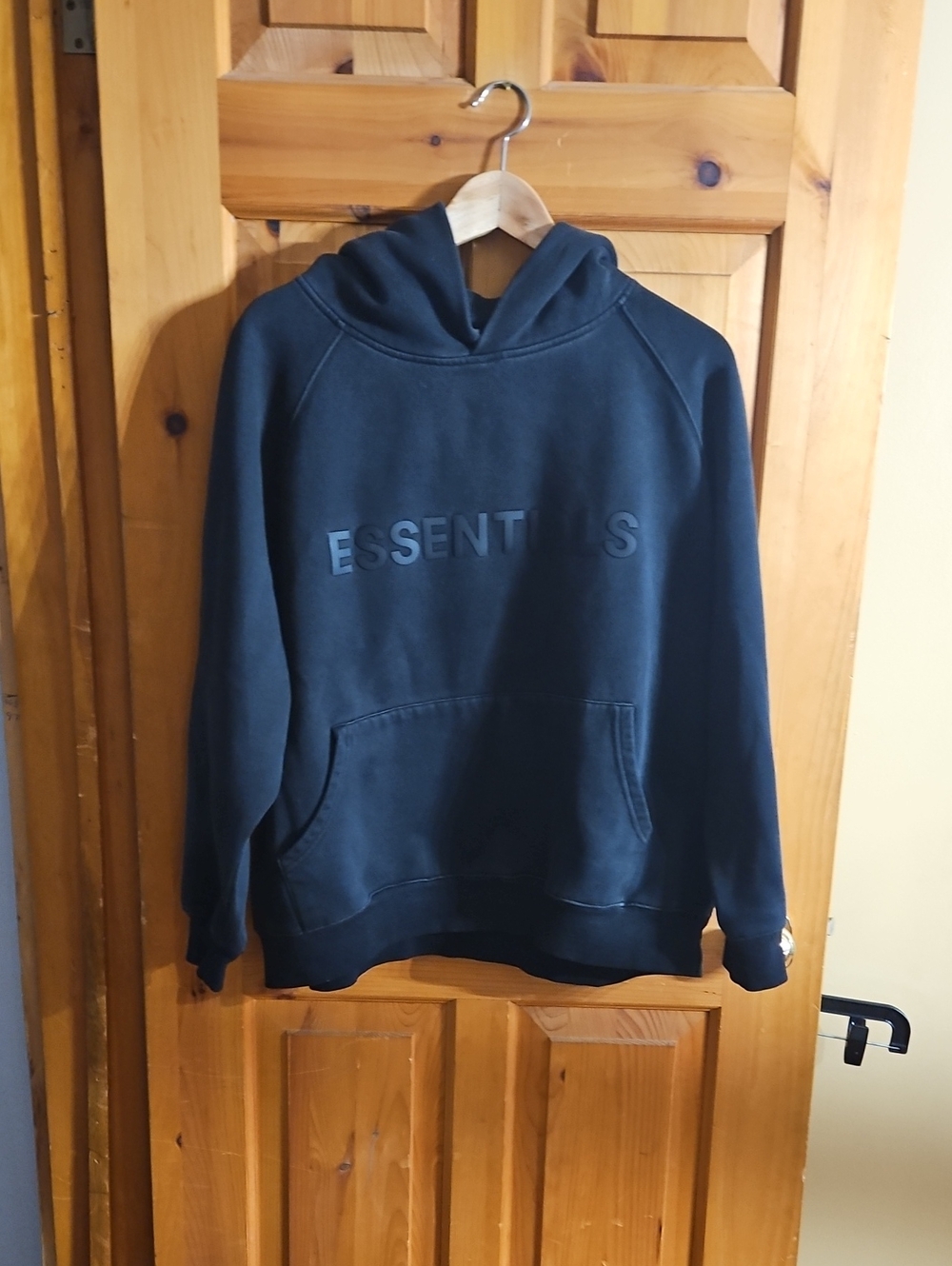 Essentials Black Pullover Hoodie with Embossed Logo